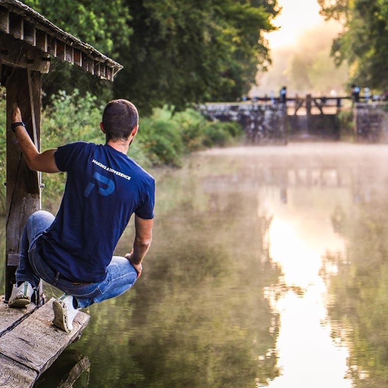 Team member near the water