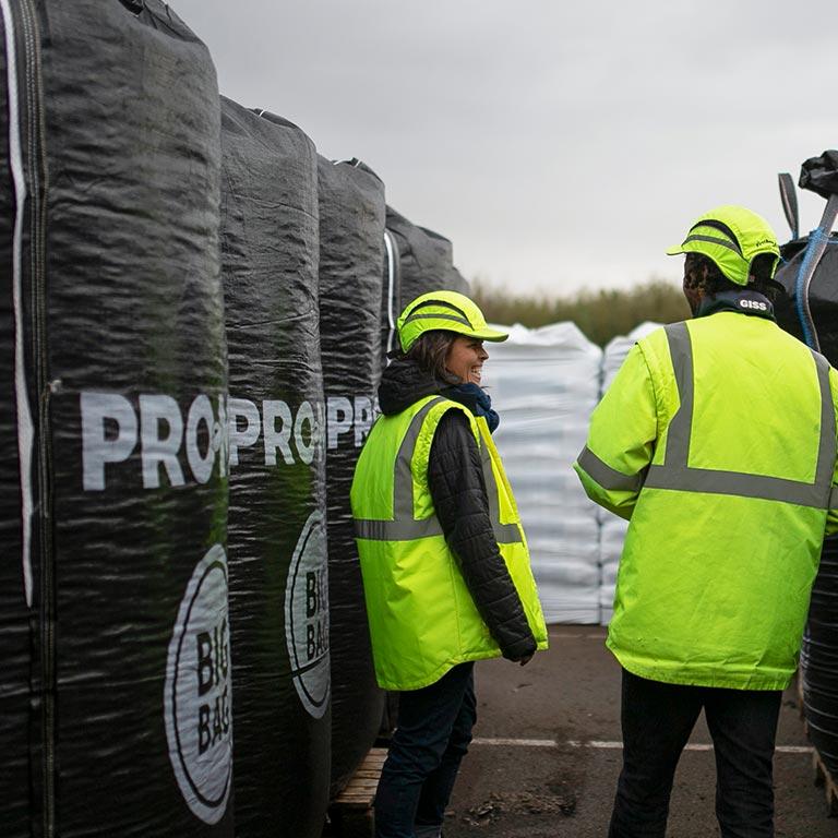 Team member near a PRO-MIX bag