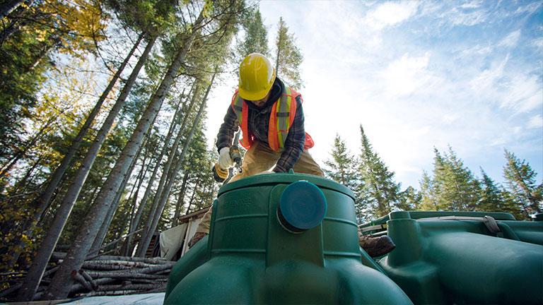 Team member installing an ecoflo