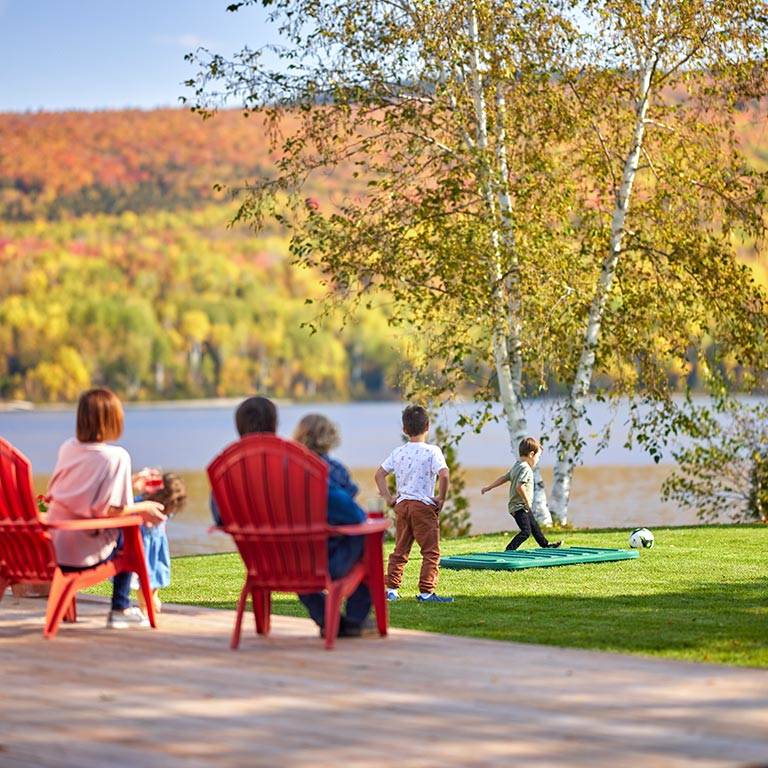 A family in their backyard with an Ecoflo biofilter