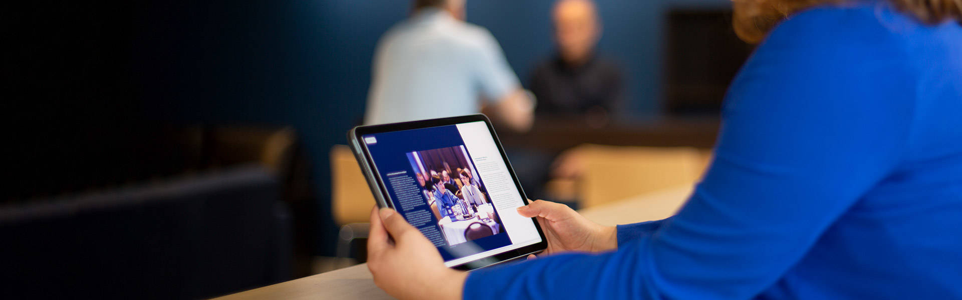 A person holding an ipad