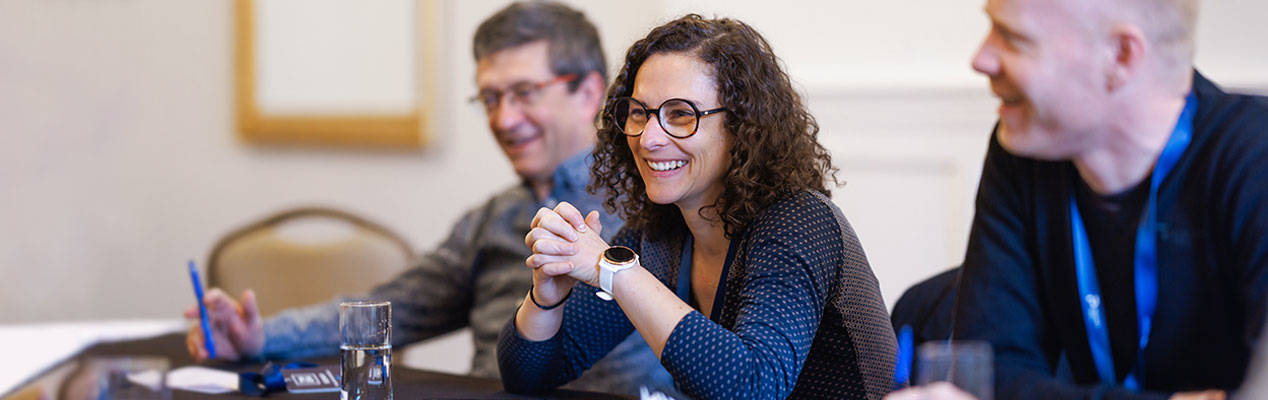 People smiling during a business meeting