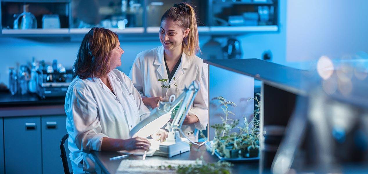 Two team members in a lab