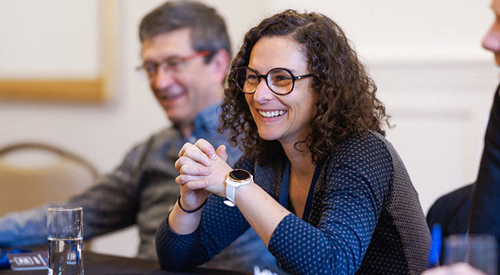 People smiling during a business meeting