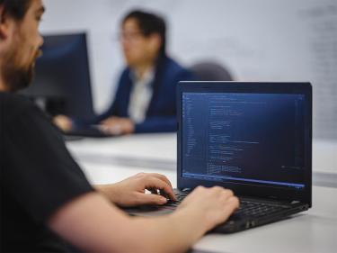 Team member working on a computer