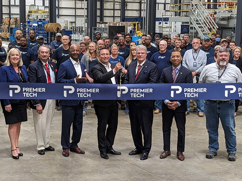 Premier Tech team members and Montgomery representatives cutting a ribbon.