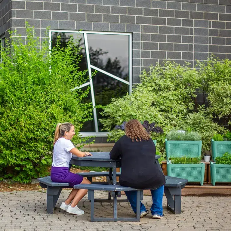 Two team members talking outside