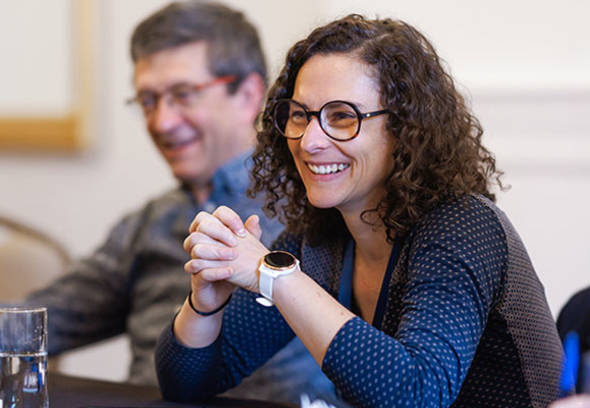 People smiling during a business meeting