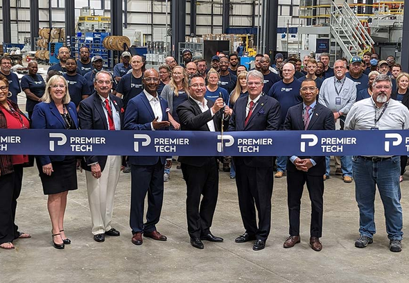 Premier Tech team members and Montgomery representatives cutting a ribbon.