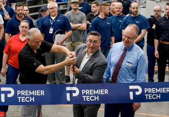 Premier Tech team members and Ryan Westergard, mayor of Wood Cross City cutting a ribbon.