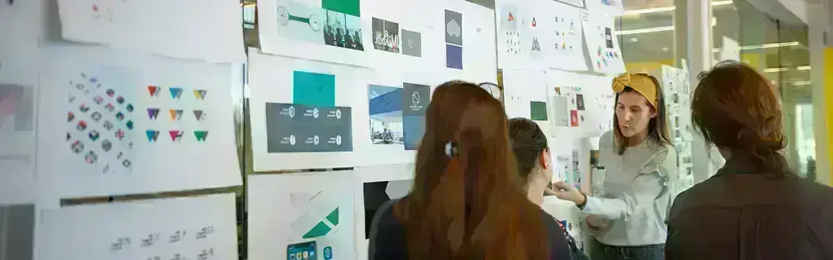 Team member pointing at charts