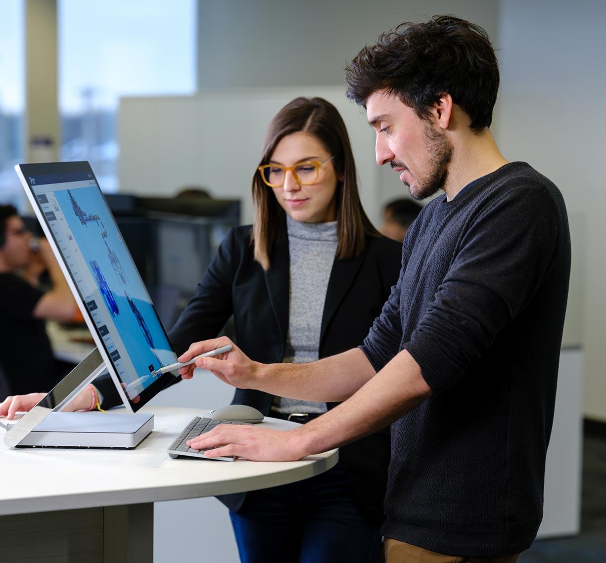 Team member looking at a computer