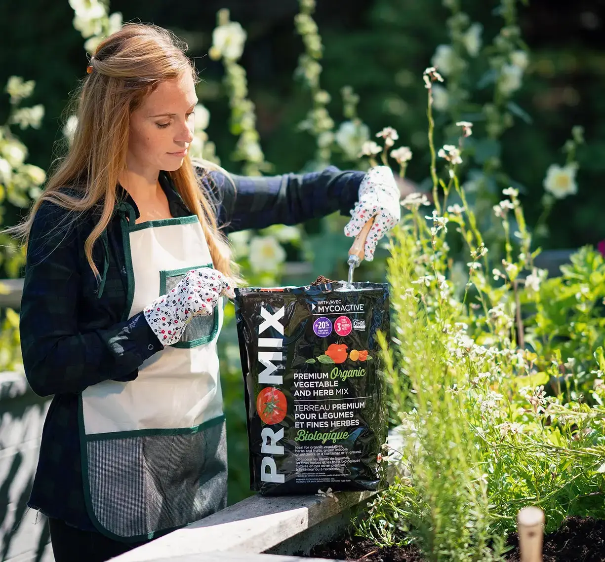 Someone with a PRO-MIX bag