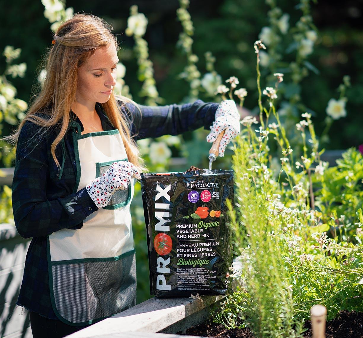 Someone with a PRO-MIX bag