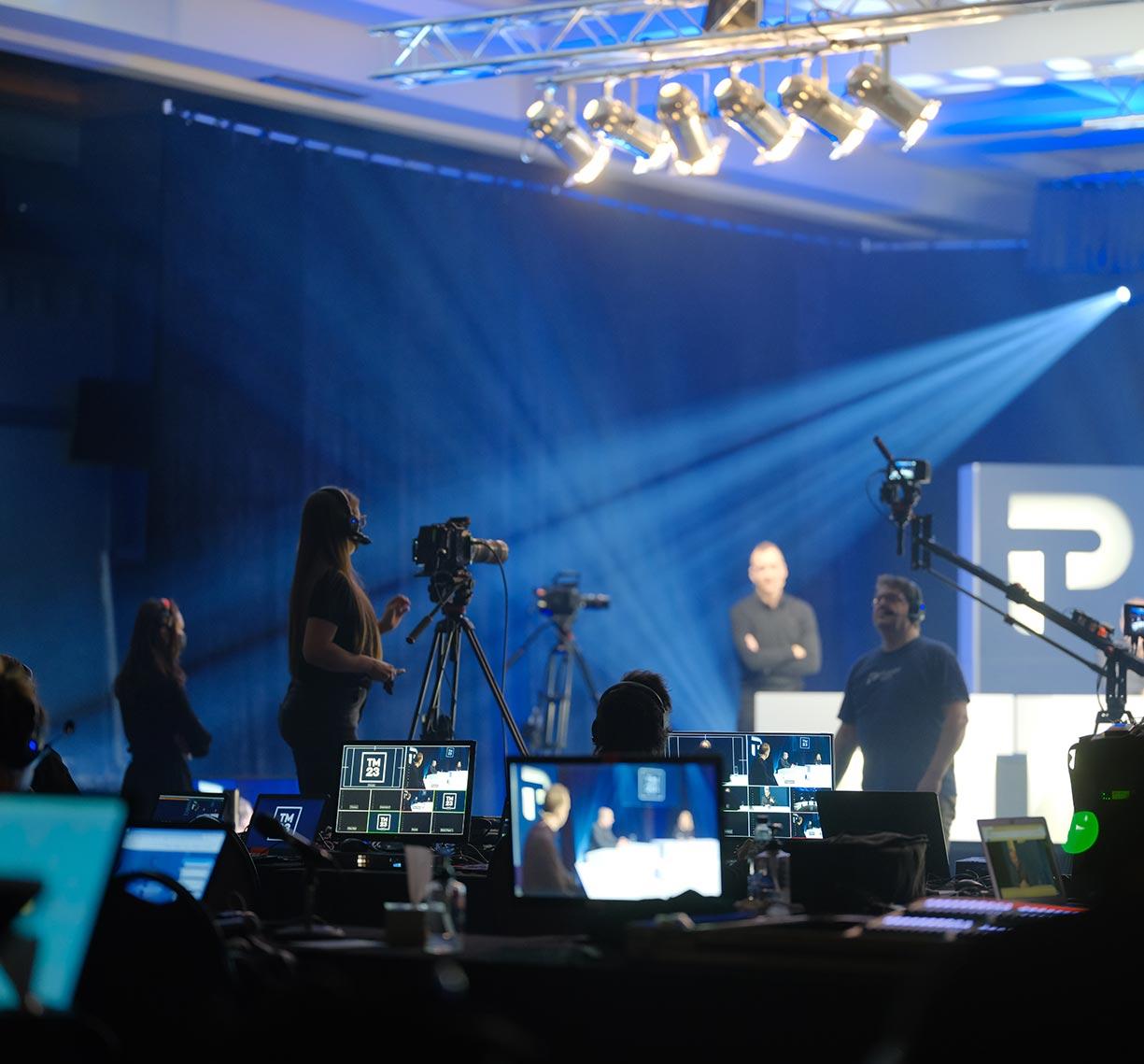 Team member talking in front of a camera