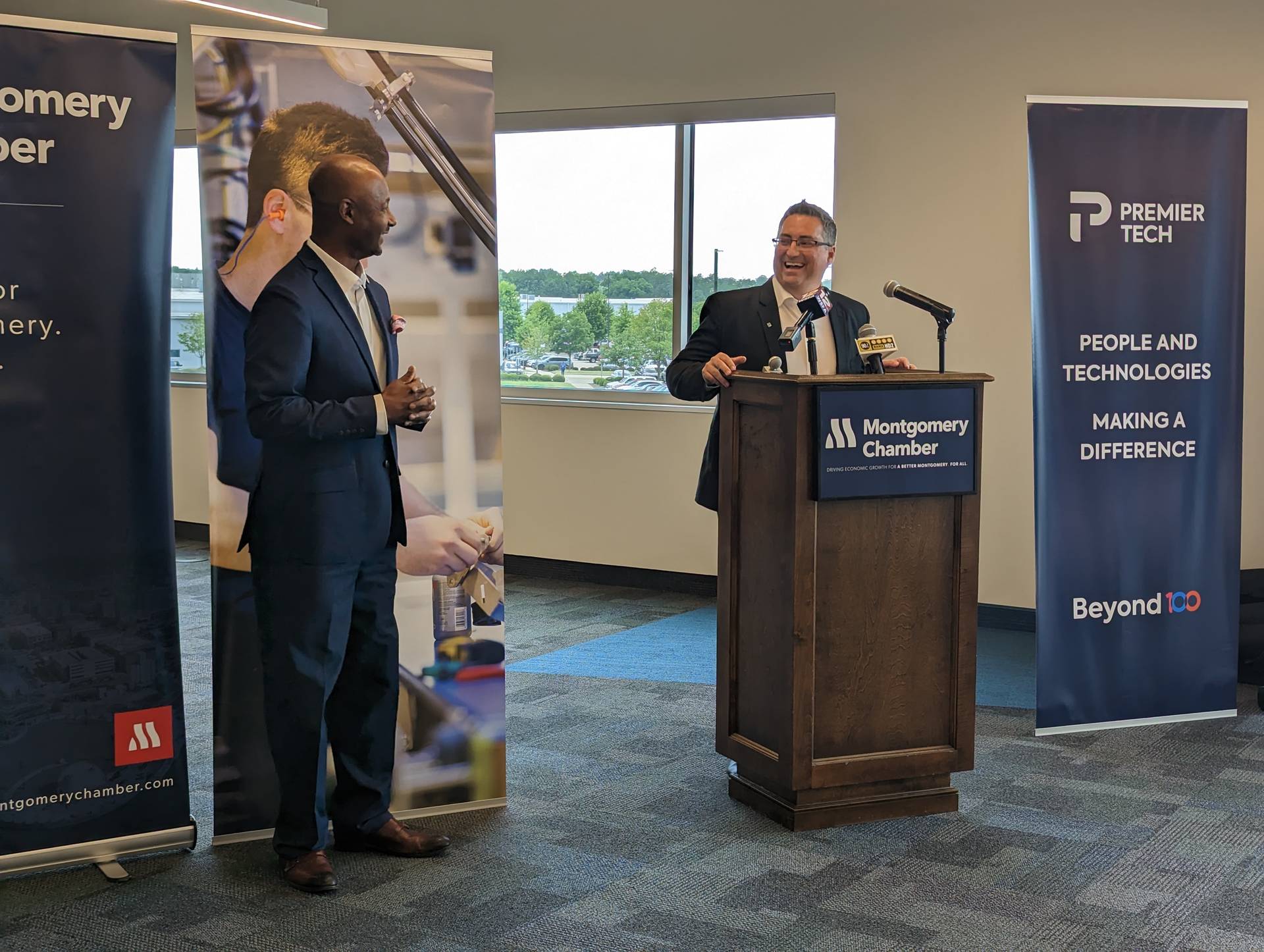 Team members talking during the Montgomery grand opening.