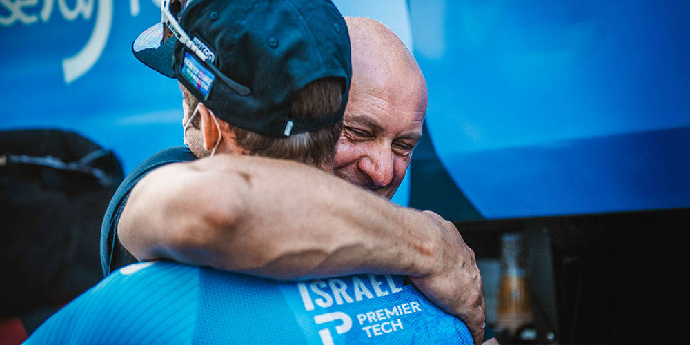 Steve Bauer and Hugo Houle hugging