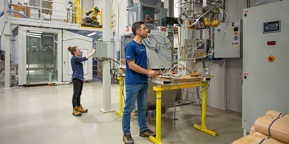 Team members working in a plant
